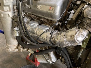 Exhaust manifold heat shield cover